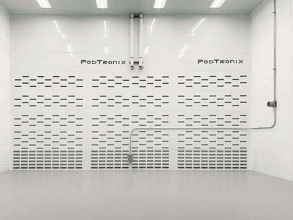 Optimized airflow wall — full-height perforated return panel pulling vapor downward and out via dual-speed exhaust.