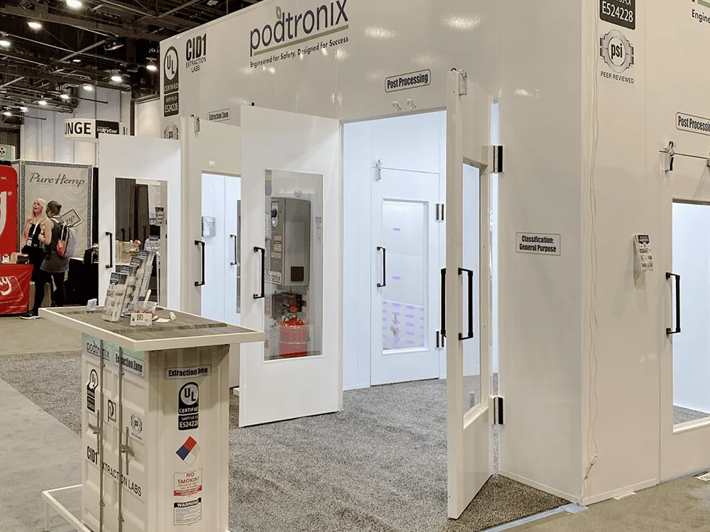 Podtronix MJBizCon display enclosures show how modular rooms, access points and control systems can be presented together.