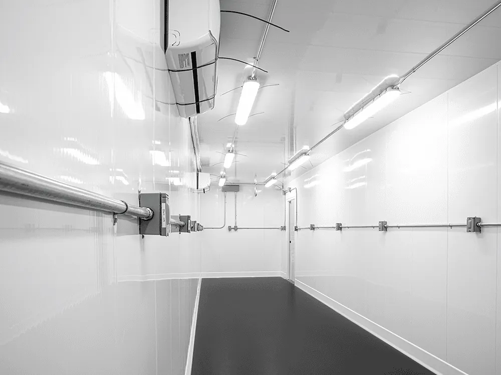 Interior of a Grow POD configured with overhead LED fixtures, integrated electrical drops, and full-length canopy rail — ready for plant racks.