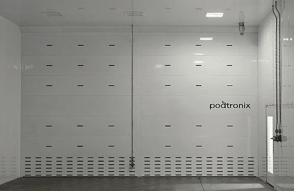 Interior vent wall – full-width louvered lower plenum, flush FRP panel system, and C1D1-rated explosion-proof light overhead