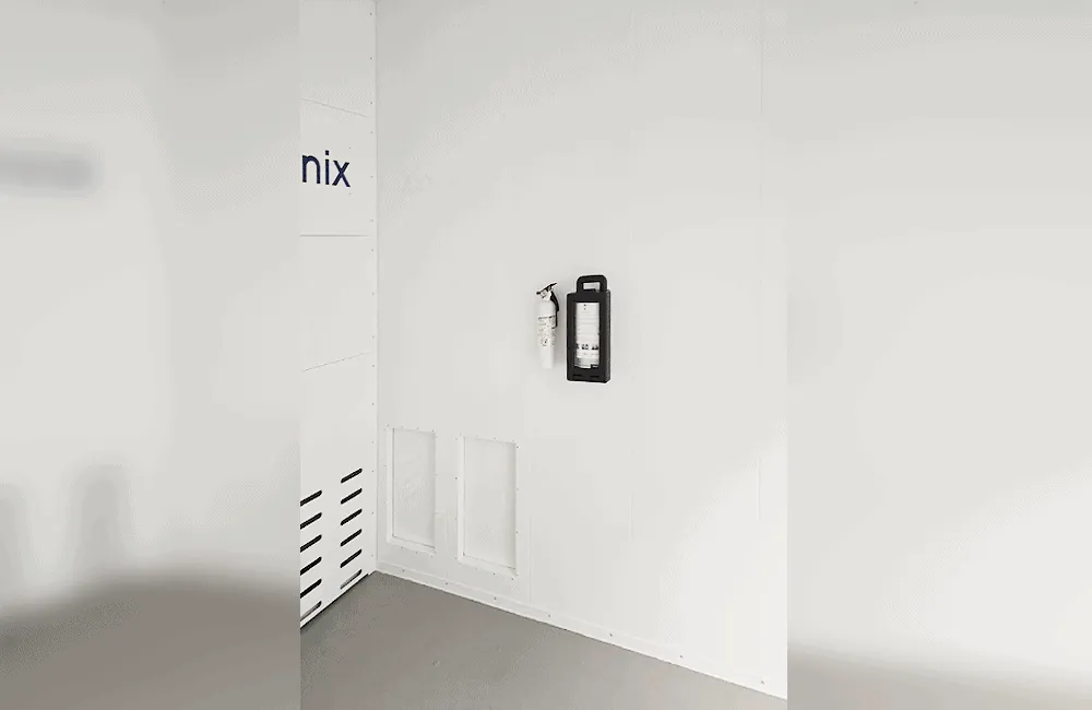 Interior corner view – flush panel walls with fire extinguisher station and cleanout access panel